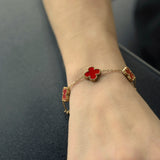 Armband Kleeblatt rot, vergoldet